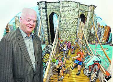 A balding man in a suit stands next to a vibrant, cartoon-like illustration of a bridge with people.