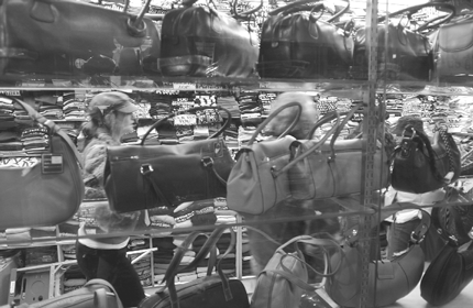 Women go underground on Canal St. for hot handbags