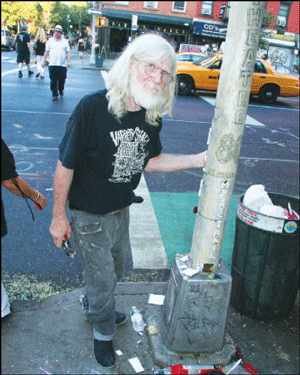  Jim Power in 2010 working on his gangster/Theater 80 street lamppost at St. Mark’s Place and First Ave., near the theater and the Museum of the American Gangster.