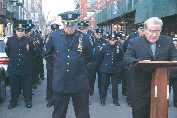 Auxiliary officers salute their fallen comrades.