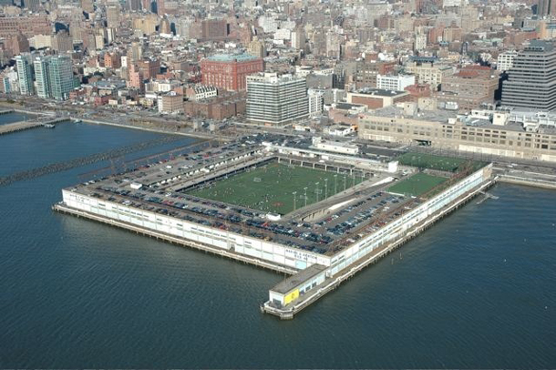 An aerial view of what Pier 40 looks like now, ringed by its three-story "donut"-shaped pier shed.