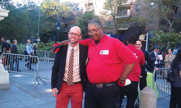 William Kelley, the Village Alliance business improvement’s executive director, left, with a member of Archangel Security at Taste of the Village last September. Since its inception, the annual food-tasting fundraiser has donated more than $400,000 for horticultural, sanitation and public safety services for Washington Square Park. 