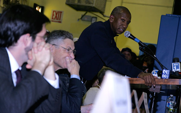 At a November 2012 meeting, Jim Simmons, right, of AREA Property Partners, which owns Knickerbocker Village, addressed hundreds of tenants, as state Senator Daniel Squadron, far left, and Assembly Speaker Sheldon Silver, listened. Photo by Sam Spokony