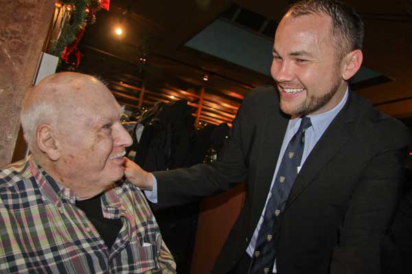 At the D.I.D. holiday party, Tom Connor, chairperson of the advisory board of The Caring Community at 20 Washington Square North, schmoozed with Corey Johnson, who is running for the City Council seat being vacated by Christine Quinn.   Photo by Tequila Minsky 