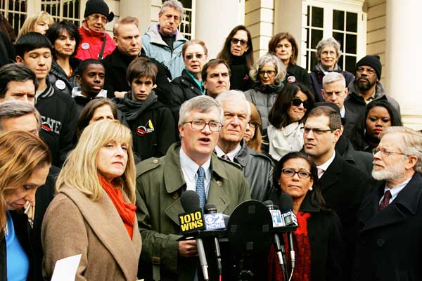 Assemblymember Brian Kavanagh, flanked by fellow members of a legislative coalition for new statewide gun control, led a press conference outside City Hall on Dec. 20.