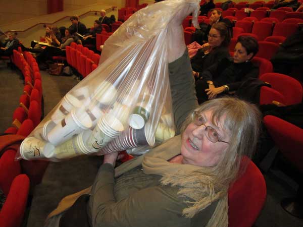 Minerva Durham held up a bagful of 135 discarded coffee cups she collected at her Spring Studios during a week’s time, proof, she said, that the area around Petrosino Square, at Lafayette and Spring Sts., already has more than ample coffee outlets.   Photo by Lincoln Anderson