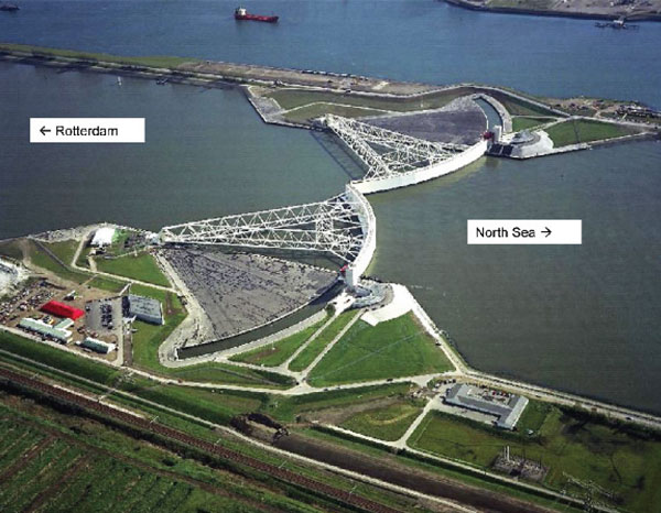 Board 2 hears ideas from storm surge prophets 3 Another image from Bowman’s report showing a different style of surge protection in the Netherlands. Twin sector gate barriers (Tainter gates) protect the port of Rotterdam, the world’s largest, against North Sea storm surges. The gates are shown closed in the storm surge position. Normally, the gates are kept open, rotated back into their parking areas. The New York Harbor concept plan calls for a combination of drop-down gates and Tainter gates.
