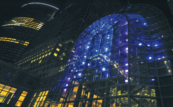Obie-Award-winning theatrical lighting designer Anne Militello has orchestrated a changing display of jewel-like lights for the Winter Garden of the World Financial Center. The light show, commissioned by Arts Brookfield, is visible from sunset to midnight through March 30.   Downtown Express photo by Terese Loeb Kreuzer