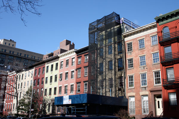 Shrouded in controversy, and scaffolding: A local coalition continues to oppose construction atop Hopper Gibbons House. Photo by Maxine Wally 