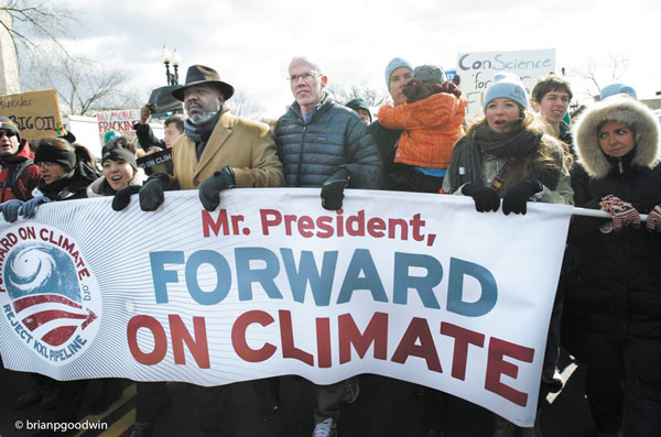 Photo by Brian Goodwin Bill McKibben, founder of 350.org, in black down jacket, center, led the march at Sunday’s rally on climate change in D.C.