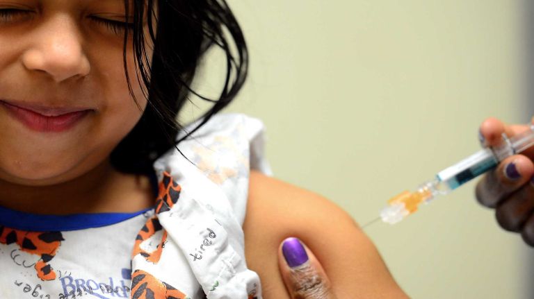 Kaylle Zellaya gets a flu shot at Nassau University Medical Center. (Jan. 11, 2013)