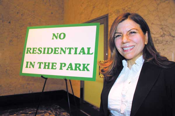 Maria Passannante Derr spent the whole time outside the forum asking people entering and exiting to sign her petition against residential use in the park. Photos by Tequila Minsky