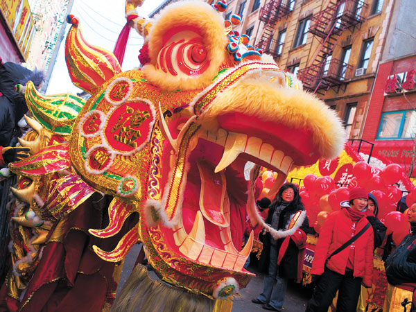 SNAKES & DRAGONS Chinatown celebrated the Year of the Snake Sunday with its Lunar New Year parade down Mott St.  See P. 16 for more photos of the parade and the firecracker celebration a week ago.   Downtown Express photo by Milo Hess 