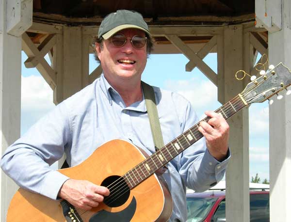 Charlie Walker with his omnipresent guitar.