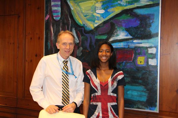 Chantelle Roulston, whose family was displaced from Rockaway Beach after Hurricane Sandy, wrote a story about it which earned her  a full high school scholarship to Léman Manhattan. With her is Drew Alexander, head of the school.  Downtown Express photo by Kaitlyn Meade 