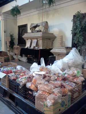 At Manor Community Church, Food Ministry Feeds Body & Soul 1 Photo by Scott Stiffler On March 2, boxes of food await distribution following a 3pm service at Manor Community Church.