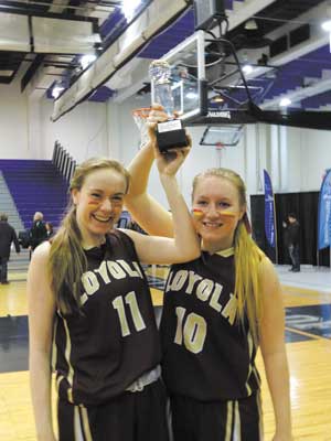 Photo courtesy Loyola School  Co-captains Adriana Ilnicki, right, and Emma McCauley hoisted the trophy after Loyola won the NYCAL championship.