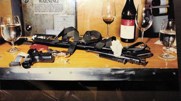 An evidence photo from the district attorney shows Steven Johnson’s weapons on the bar at Bar Veloce after he was apprehended.