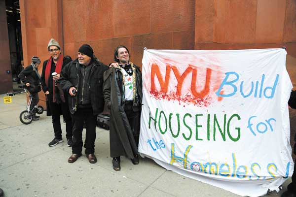 At the start of John Penley’s campout protest outside Bobst Library last Friday were, from left, Barbara Ross, Frank Morales, Penley and L.E.S. Jewels.  Photo by Jefferson Siegel