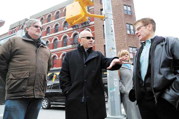 Sal Albanese, center, was filled in on the basics of the N.Y.U. 2031 plan at the start of Friday’s superblocks tour by Bo Riccobono, right, and Jeff Goodwin, left, as Linda Cronin-Gross, N.Y.U. FASP public-relations director, rear, listened.   Photo by Jefferson Siegel