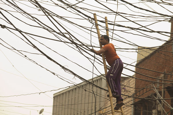 ‘Powerless’ of particular relevance, post-Sandy 2 Photo by Egon Johann Vencour Power to the people: Loha Singh risks life and limb to supply the have-nots with electricity.