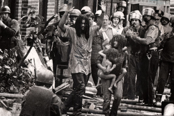 MOVE Documentary is Well Done, Moving 1 In a 1978 confrontation, MOVE members and children emerge from their “headquarters.” Photo by Sam Psoras