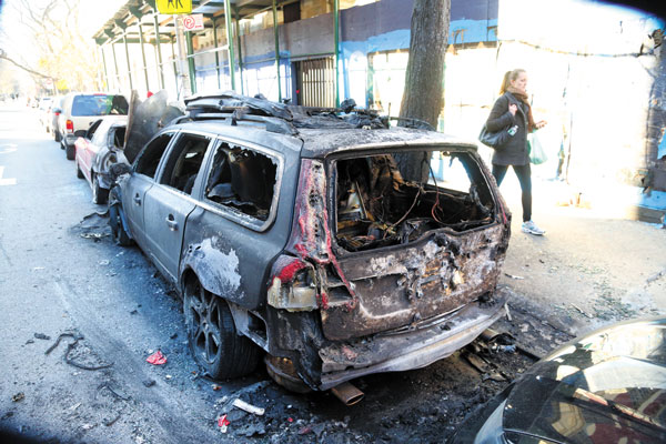9th St. demo was fiery, literally: Three cars torched at CHARAS 1 Photo by Jefferson Siegel The first car to catch fire sat between two other cars, which also caught aflame.