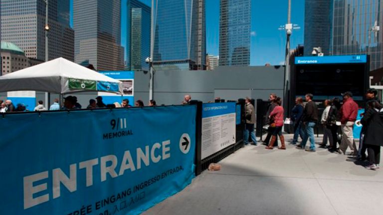 Visitors enter the  9/11 Memorial Sunday. (Charles Eckert)