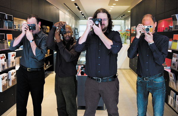 Photo by Bob Krasner Holding their own: Soho Leica store staff with their favorite cameras, from left: manager Chris Durkin, with the ME; salesman Craig Williams, with the MP (film camera); salesman John Flanigan, with the Monochrom; and owner Elliot Kurland, with the M9-P Hermes Special Edition. The photo was taken with a $35,000 M9 Titanium.