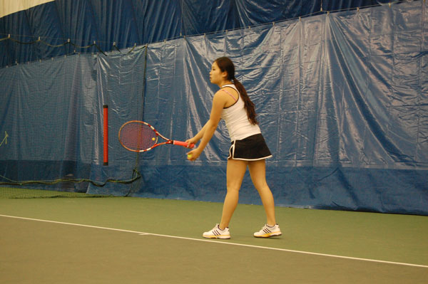 N.Y.U.’s Alison Wang tees up a serve against Ithaca College.  Photo by Daniel Jean-Lubin 