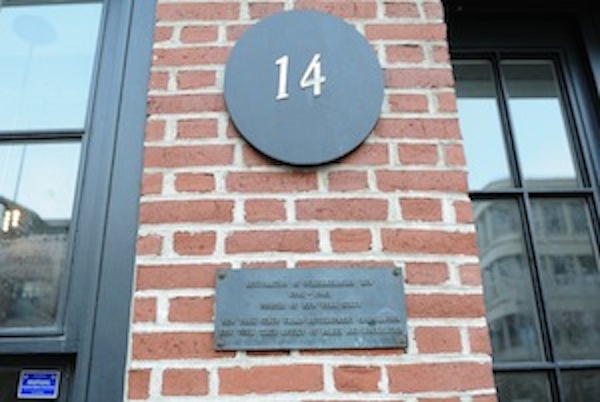 Plaque showing the Seaport's retail complex was built with state public money. Downtown Express photo by Terese Loeb Kreuzer