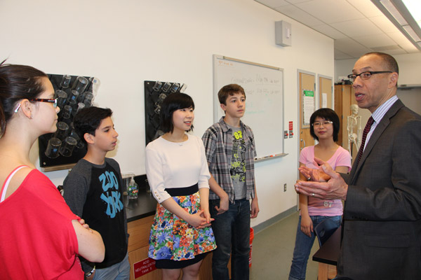 Downtown Express photo by Kaitlyn Meade Schools Chancellor Dennis Walcott spoke with I.S. 276 students Maya Gardner, left, Julian Apprendi, their teacher Youngjee Kim, and fellow classmates Max Sano and Ashley Ip.  The U.S. Army awarded the students $500 bonds for their science work.