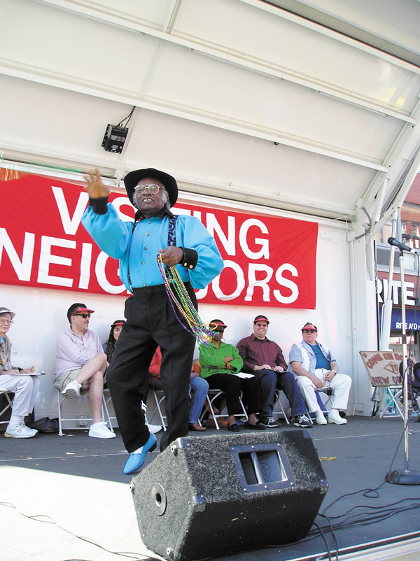 At Visiting Neighbors Street Fair, Talent is Ageless 4 Photos courtesy of Visiting Neighbors Second Place winner Jim Porter throws Mardi Gras trinkets to the crowd.