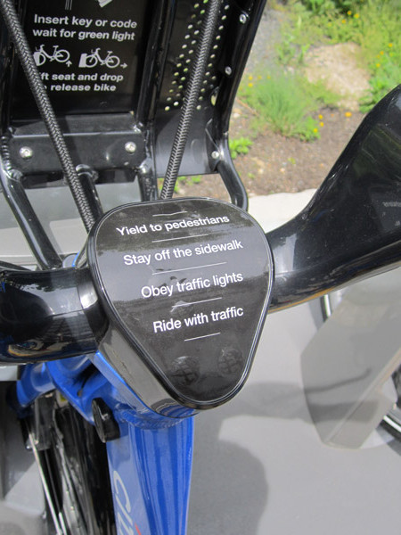 Each Citi Bike has these four basic rules of the road displayed clearly on the top of its handlebar stem.