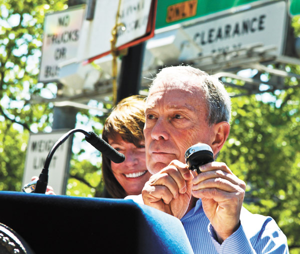 Photo by Tequila Minsky You can ring his bell: Mayor Bloomberg used a bicycle bell Monday to kick off Citi Bike, New York’s new bike-share program, as D.O.T. Commissioner Janette Sadik-Khan, behind him, beamed proudly.