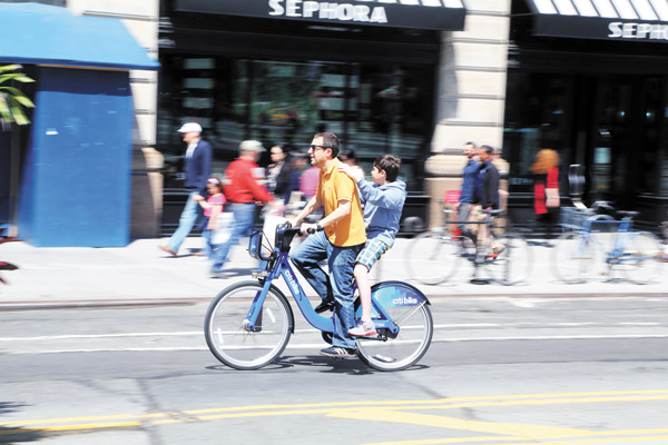 And they’re off! Bike-share cycles finally hit the streets 4 Photos by Jefferson Siegel Lee Schalop and his son David, cycling in Union Square, came down from the Upper West Side on Monday just to try out a Citi Bike. (Hey, is riding double considered fare-beating?)