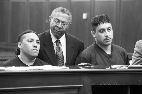 Photo by Jefferson Siegel  Fabian Ortiz, left, and Pedro Jimenez, right, at their arraignment last week, with their Spanish-language interpreter.