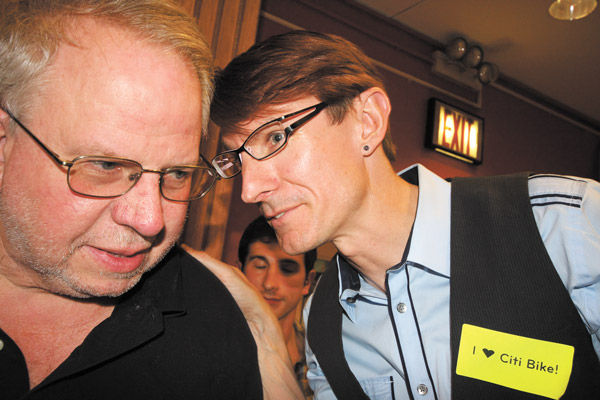 Ian Dutton, right, shared a thought with fellow bike-share advocate Charles McCorkell, owner of Bicycle Habitat. 