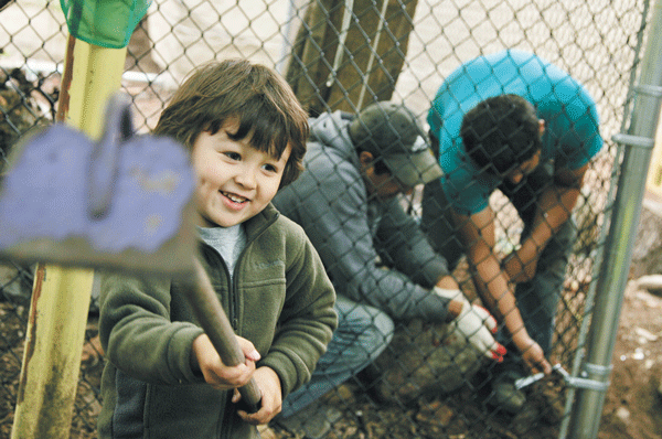 Photo by Sam Spokony Taiyo Kizawa, 3, who lives around the corner from the garden and comes there often with his mother, played while workers fenced off the land owned by Hoyda.