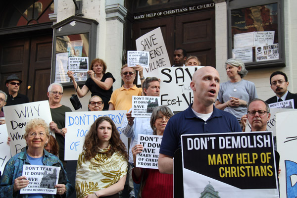 Andrew Berman, executive director of G.V.S.H.P., at right, speaking at the May 22 rally outside Mary Help of Christians Church.