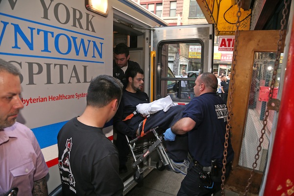 Photos by Jefferson Siegel Morgan Soto being removed from Centre Buffet restaurant after being arrested for allegedly carrying a 16-inch sword in Chinatown while acting erratically.