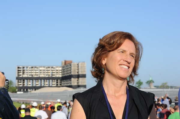 Leslie Koch, president of the Trust for Governors Island, in front of an island building demolished June 9. Downtown Express photo by Terese Loeb Kreuzer.