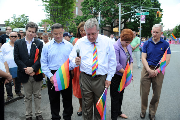 Photo by Donna Acceto At the June 2 Queens LGBT Pride Parade, elected officials, including State Senator Brad Hoylman, Comptroller John Liu and Councilmembers Letitia James, Daniel Dromm, Christine Quinn and Jimmy Van Bramer, paused for a moment of silence to commemorate the recent victims of anti-gay violence.