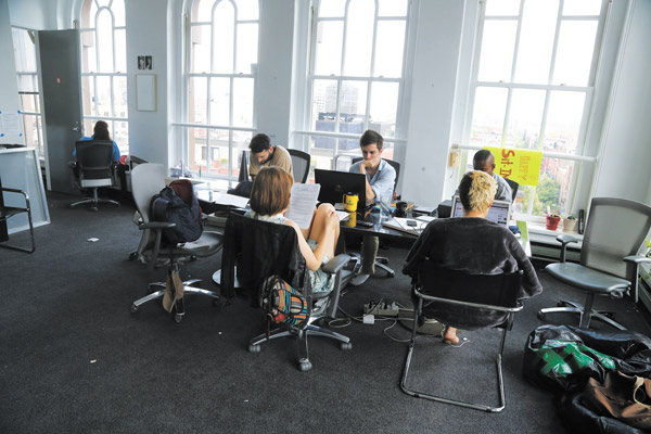 On Tuesday, some of the Cooper Union occupiers worked on their computers in President Bharucha’s office as a security guard sat nearby, at far left.