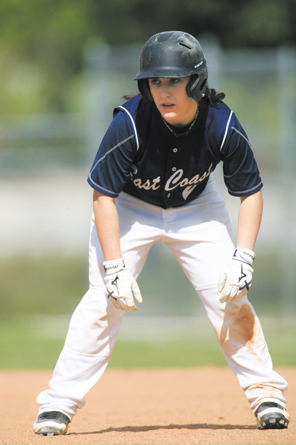 Hera Andre-Bergmann keeps her eye on the pitcher while leading off base in a game with the East Coast Yankees, a women’s baseball team in New Jersey.