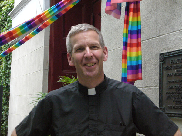 Photo by Lael Hines Pastor Mark Erson in front of St. John’s Lutheran Church.