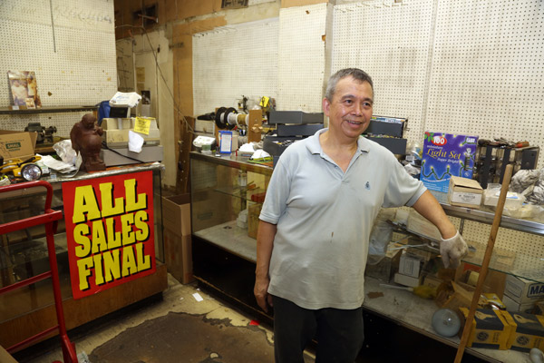 Photo by Jefferson Siegel Virote Sirirat Sivawong, a.k.a. “Tang,” started working at T.S. Hardware and Locksmith 44 years ago at age 19. The place is almost empty now and he expects to close within the week.