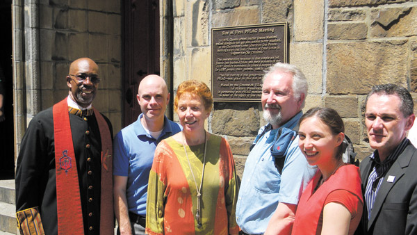 At the PFLAG plaque unveiling last Sunday, from left, Bishop Alfred Johnson of Church of the Village; Andrew Berman, executive director of G.V.S.H.P.; Suzanne Ramos, a PFLAG board member; Mark Peters, a church member; Reverend Vicki Flippin, and Jody Huckaby, PFLAG national executive director.