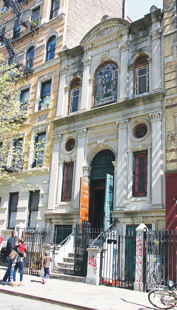 The now closed Mesertiz Shul on E. 6th St., left.  Hauling a piece of the ark, right.   Photo courtesy of Tamid