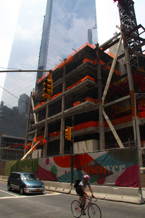 Downtown Express photo by Yoon Seo Nam Construction work on 3 World Trade Center, seen here in front of almost-completed 4 W.T.C., is expected to continue now that GroupM has agreed to the major parts of a lease to move into the building. 